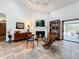 Mid-century modern living room with fireplace and access to patio at 1701 Cedar Stone Ct, Lake Mary, FL 32746