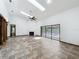 Spacious living room with tile flooring, fireplace, and sliding glass doors leading to the pool area at 1701 Cedar Stone Ct, Lake Mary, FL 32746