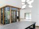 Bright living room featuring plant atrium, marble countertops, and view of pool through sliding glass doors at 1701 Cedar Stone Ct, Lake Mary, FL 32746