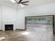 Bright living room featuring a fireplace and sliding glass doors out to a pool and wooded backyard at 1701 Cedar Stone Ct, Lake Mary, FL 32746