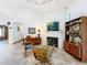 Spacious living room featuring a fireplace and mid-century modern furniture at 1701 Cedar Stone Ct, Lake Mary, FL 32746