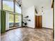Living room with ceramic tile flooring, large windows, and a fireplace at 1701 Cedar Stone Ct, Lake Mary, FL 32746