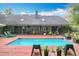 A sparkling pool is surrounded by a wood deck, offering an ideal spot for outdoor relaxation at 1701 Cedar Stone Ct, Lake Mary, FL 32746