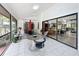 Screened porch with mid-century modern furniture and view of living room at 1701 Cedar Stone Ct, Lake Mary, FL 32746