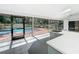 View of pool from the screened porch with tile floors and outdoor kitchen at 1701 Cedar Stone Ct, Lake Mary, FL 32746