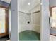 Walk-in shower with green floor and built-in seating at 1701 Cedar Stone Ct, Lake Mary, FL 32746