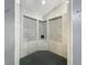 Shower with unique accent tiles and a modern design at 1701 Cedar Stone Ct, Lake Mary, FL 32746