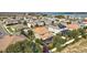 Aerial view of a house with a pool and solar panels in a quiet neighborhood at 17889 Gourd Neck Loop, Winter Garden, FL 34787