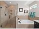 Spa-like bathroom with walk-in shower and soaking tub at 17889 Gourd Neck Loop, Winter Garden, FL 34787