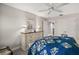 Bright bedroom with a dresser, ceiling fan, and double bed at 17889 Gourd Neck Loop, Winter Garden, FL 34787