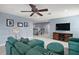 Bonus room with sectional sofa, TV, and built-in shelving at 17889 Gourd Neck Loop, Winter Garden, FL 34787