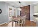 Bright dining area with wooden table and chairs, adjacent to kitchen at 17889 Gourd Neck Loop, Winter Garden, FL 34787