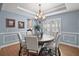 Formal dining room with wood table and chandelier at 17889 Gourd Neck Loop, Winter Garden, FL 34787