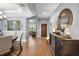 Bright entryway with wood floors and formal furniture at 17889 Gourd Neck Loop, Winter Garden, FL 34787