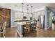 Island kitchen with stainless steel appliances and white cabinets at 17889 Gourd Neck Loop, Winter Garden, FL 34787