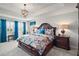 Luxurious main bedroom with king-size bed and ensuite bathroom at 17889 Gourd Neck Loop, Winter Garden, FL 34787