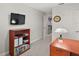 Home office with a desk, bookcase, and view of the upper hallway at 17889 Gourd Neck Loop, Winter Garden, FL 34787