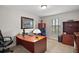 Home office featuring a desk, bookcase, and window at 17889 Gourd Neck Loop, Winter Garden, FL 34787