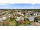 Aerial view of a residential neighborhood with houses and lush green landscaping at 1916 Antonia Pl, The Villages, FL 32159