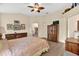 Spacious bedroom with wood floors and ceiling fan at 1916 Antonia Pl, The Villages, FL 32159