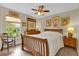 Cozy bedroom with wood furniture and a ceiling fan at 1916 Antonia Pl, The Villages, FL 32159