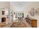 Bright dining room with chandelier and hardwood floors at 1916 Antonia Pl, The Villages, FL 32159