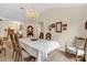 Formal dining room with a chandelier and view of living room at 1916 Antonia Pl, The Villages, FL 32159