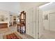 Bright entryway with hardwood floors and antique furniture at 1916 Antonia Pl, The Villages, FL 32159