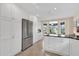 Modern kitchen featuring stainless steel appliances and white cabinetry at 1916 Antonia Pl, The Villages, FL 32159