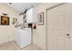 Laundry room with washer, dryer, and ample storage at 1916 Antonia Pl, The Villages, FL 32159