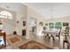 Spacious living room with hardwood floors and a view of the kitchen at 1916 Antonia Pl, The Villages, FL 32159