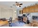 Functional home office with two workstations and ceiling fan at 1916 Antonia Pl, The Villages, FL 32159