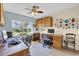 Home office with built-in cabinets and wood desk at 1916 Antonia Pl, The Villages, FL 32159