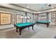 Relaxing billiards room with two pool tables and nautical decor at 2022 Wallingford Loop, Mount Dora, FL 32757