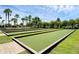 Well-maintained bocce ball courts with covered seating areas at 2022 Wallingford Loop, Mount Dora, FL 32757