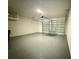 Attached garage with epoxy flooring and ample storage at 2022 Wallingford Loop, Mount Dora, FL 32757