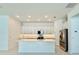 Modern kitchen featuring white cabinets, quartz countertops, and stainless steel appliances at 2022 Wallingford Loop, Mount Dora, FL 32757