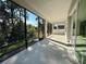 Spacious screened porch overlooking a landscaped backyard at 2022 Wallingford Loop, Mount Dora, FL 32757