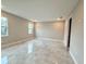 Bright bedroom with two windows and tile floors at 2046 Wallingford Loop, Mount Dora, FL 32757