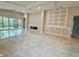 Bright living room with fireplace and tile floors at 2046 Wallingford Loop, Mount Dora, FL 32757