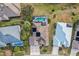 Aerial view of house, pool and surrounding homes at 2054 Vision Ct, The Villages, FL 32163