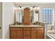 Double vanity bathroom with a large mirror and ample storage at 2054 Vision Ct, The Villages, FL 32163