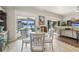 Kitchen dining area with table and chairs, pool view at 2054 Vision Ct, The Villages, FL 32163