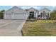 Beautiful home with three-car garage and landscaping at 2054 Vision Ct, The Villages, FL 32163