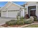 Three-car garage and welcoming entryway at 2054 Vision Ct, The Villages, FL 32163