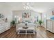 Main bedroom with a king-size bed and white dresser at 2054 Vision Ct, The Villages, FL 32163