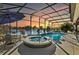 Stunning pool and spa with lake view, outdoor seating area at 2054 Vision Ct, The Villages, FL 32163