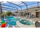 Inviting pool and spa with covered lanai at 2054 Vision Ct, The Villages, FL 32163