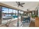 Bright sunroom with a view of the pool, lake and patio at 2054 Vision Ct, The Villages, FL 32163