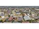 Aerial view of a residential neighborhood with houses and a lake at 2080 Nordic Ln, The Villages, FL 32163